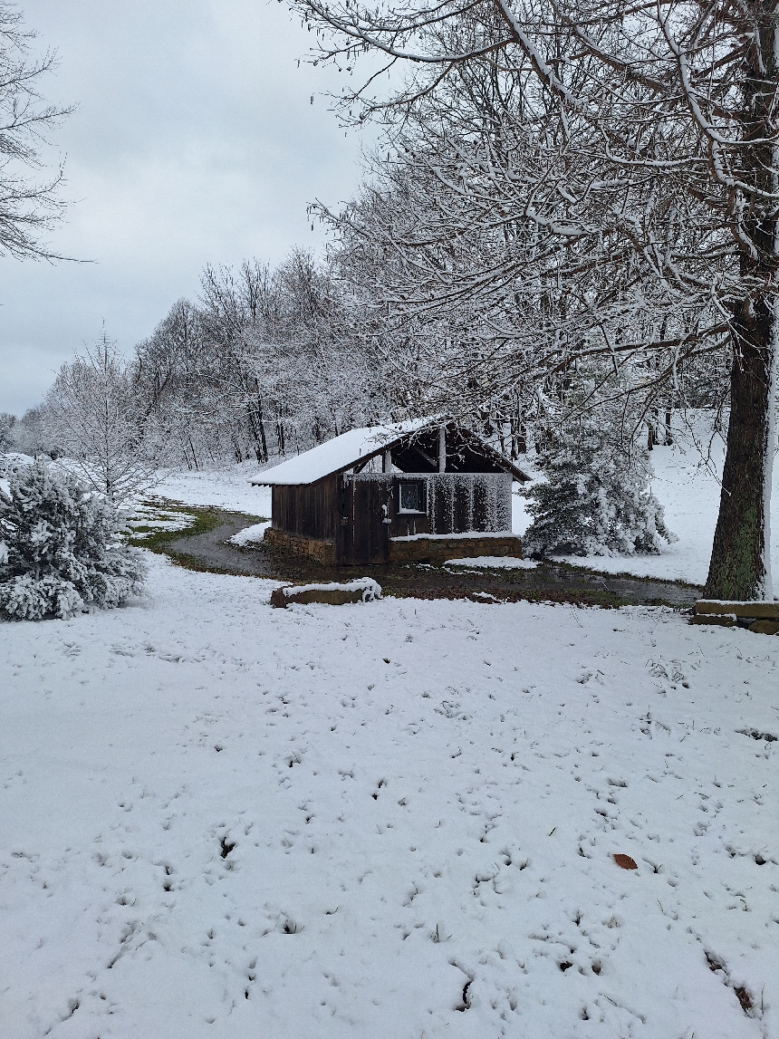 spring house in snow spring house in snow